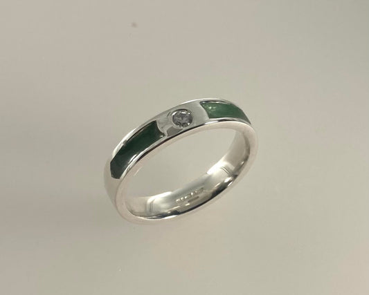 Single brilliant cut stone set in rub over 4mm wide ring with ashes in resin