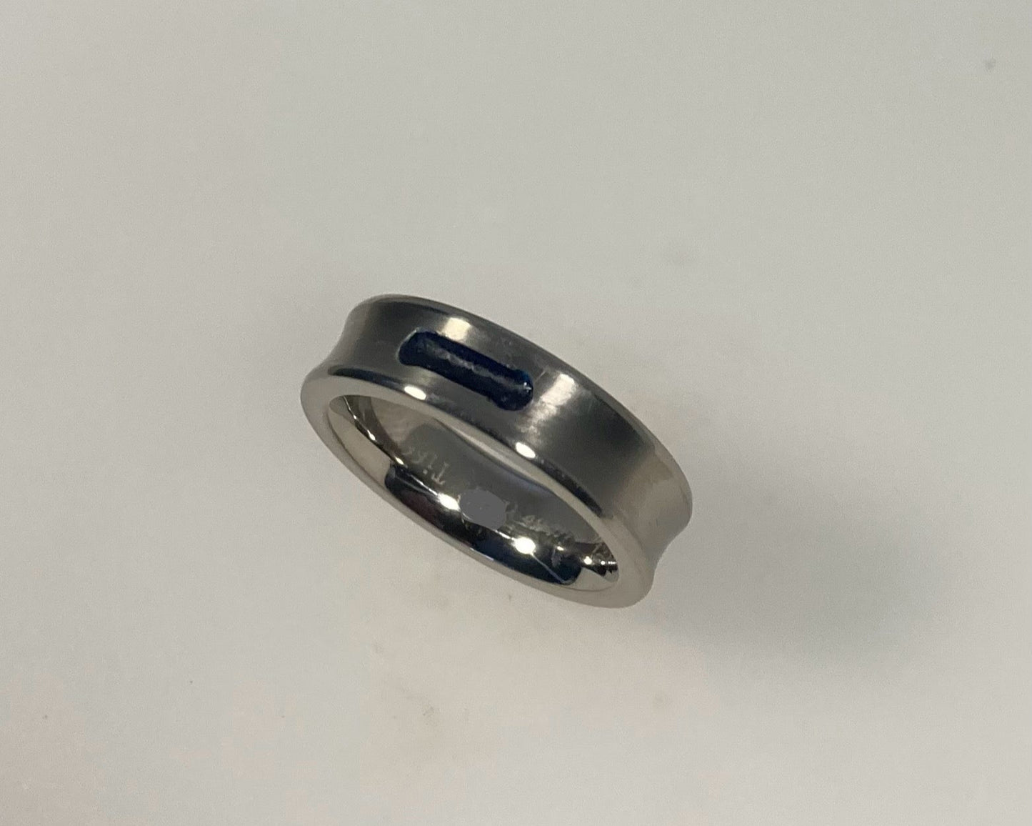 Concave titanium ashes in resin ring