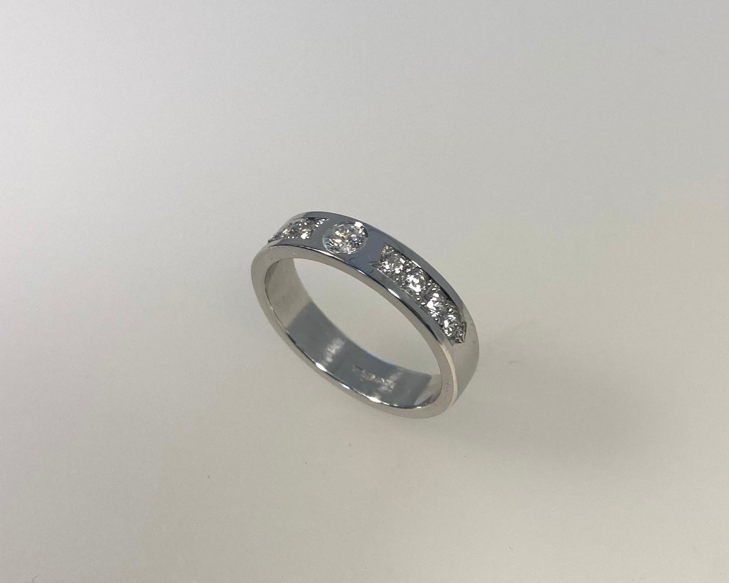 Rub over and pavé set 4mm wide ring with hidden ashes inside shank