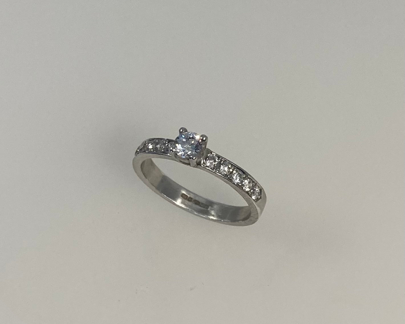 Claw plus pavé set 3mm wide ring with hidden ashes inside shank