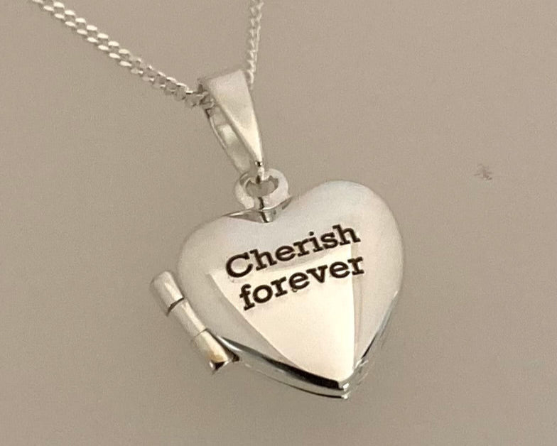 Simple bark texture 4mm wide flat ring with hidden ashes inside shank .