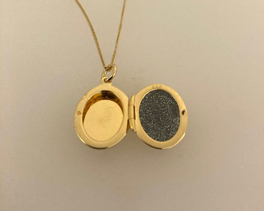 Gold plated over Silver oval locket with ashes mixed with resin plus chain
