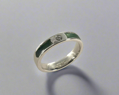 Single Brilliant cut stone set in rub over 4mm wide Flat-shaped Tribute ring with Diamond dust in resin