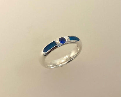 Single Brilliant cut stone set in rub over 4mm wide D-shaped Tribute ring with Diamond dust in resin