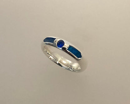 Single Brilliant cut stone set in rub over 4mm wide D-shaped Tribute ring with Diamond dust in resin