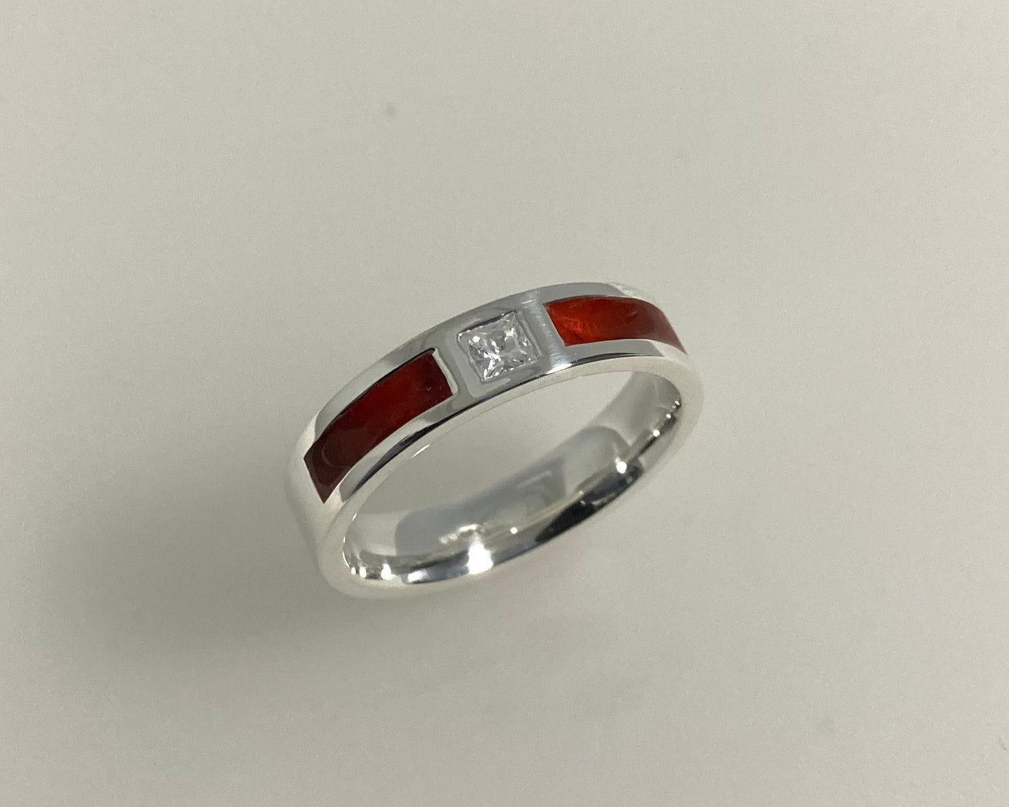 Princess cut stone set in rub over 5mm wide flat Tribute ring with Diamond dust in resin