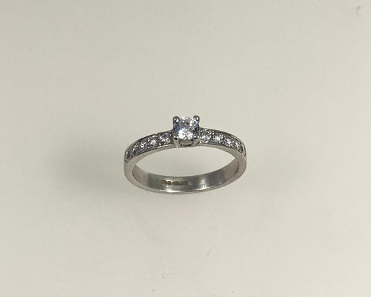 Claw plus pavé set 3mm wide ring with hidden ashes inside shank