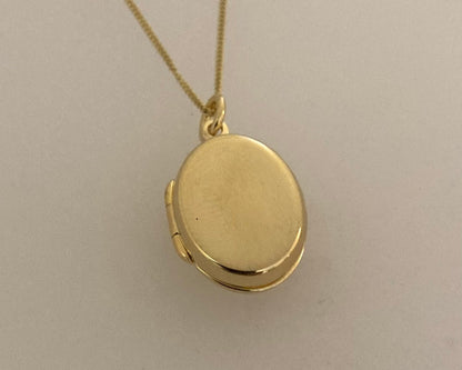 Gold plated over Silver oval locket with ashes mixed with resin plus chain