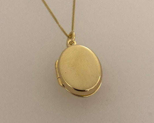 Gold plated over Silver oval locket with ashes mixed with resin plus chain