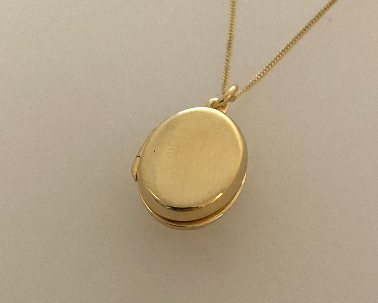 Gold plated over Silver oval locket with ashes mixed with resin plus chain