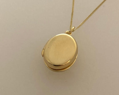 Gold plated over Silver oval locket with ashes mixed with resin plus chain