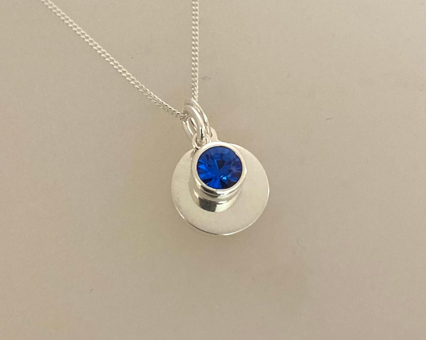 Stirling silver pendant drop and disc with ashes sealed under birthstone